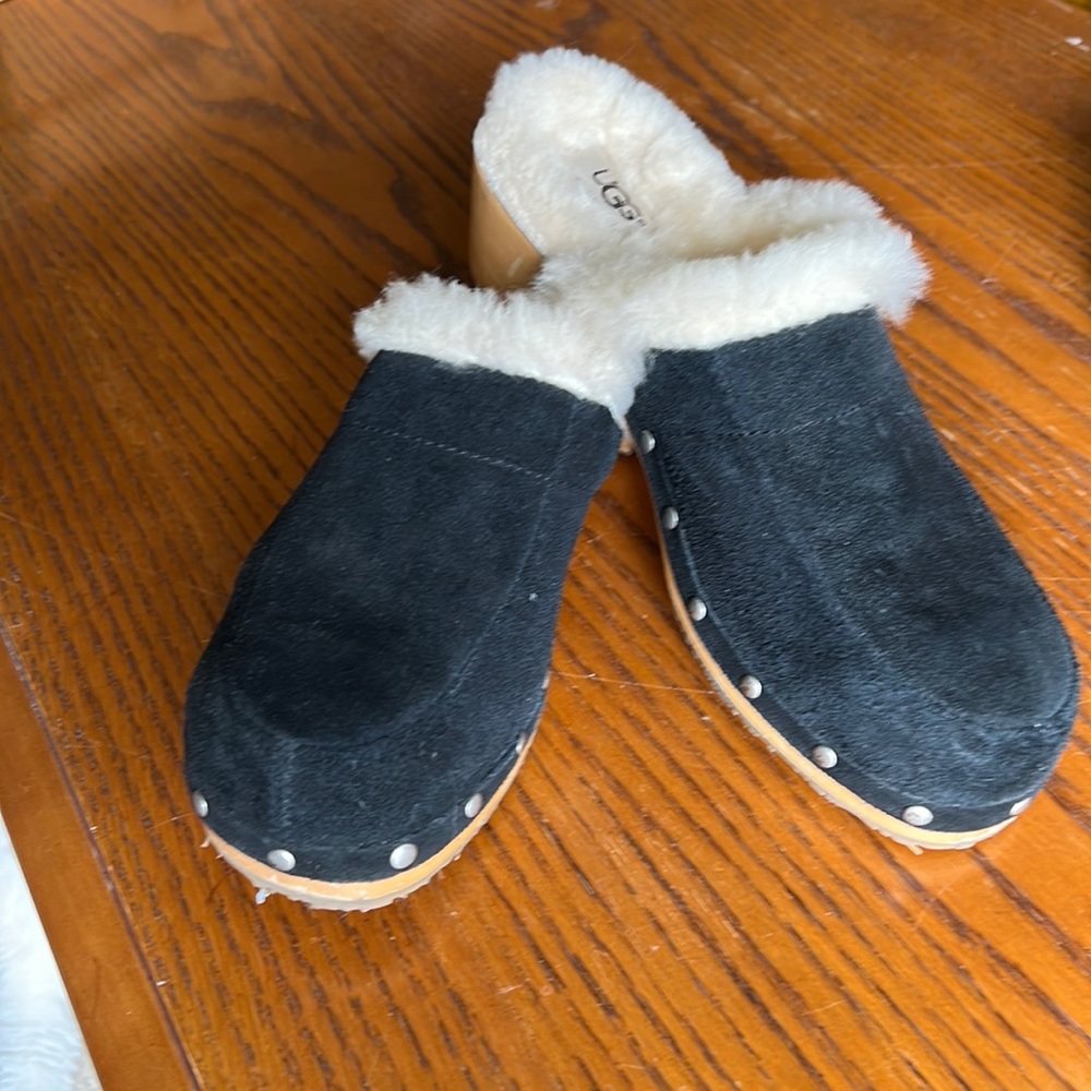 Ugg Women’s black suede clog, shearling lined.